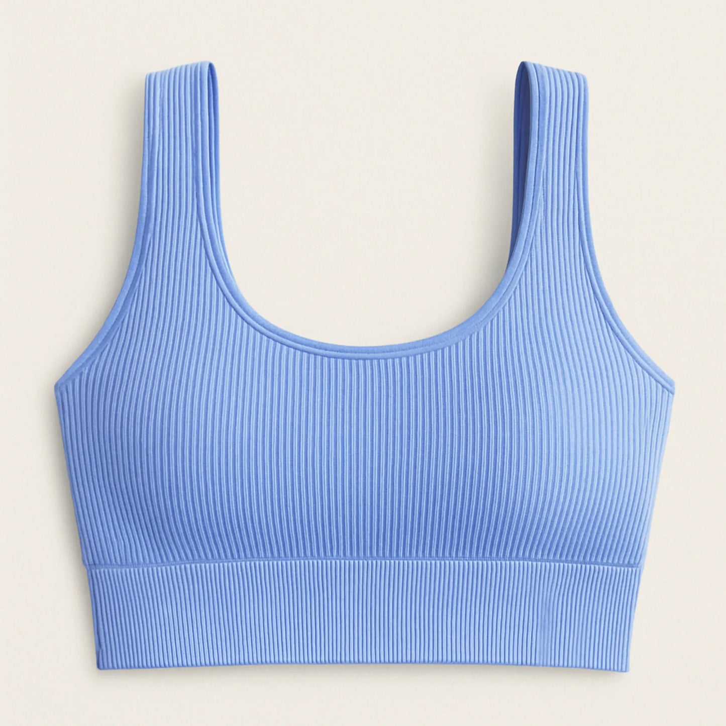 Detalle del tejido sin costuras del bra deportivo ADAFIT, con textura suave acanalado para mayor confort color azul